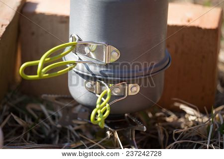 A Closeup Of A Boiling Pot On A Gas Primus Cooking Dinner For Hikers. Outdoors Kitchen.