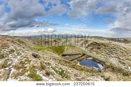 Bridleway In The South Pennines Curving Around A Moorland Scene