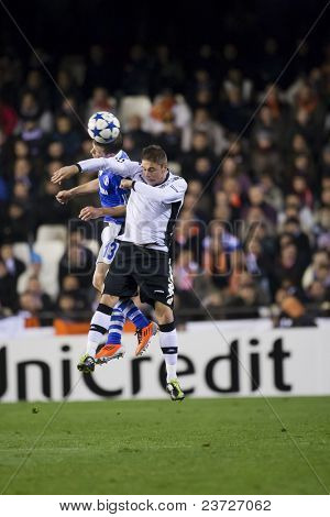 VALENCIA, SPAIN - FEBRUARY 15 - Left #13 Schmitz and Joaquin in the UEFA Champions League between Valencia C.F. vs Schalke 04 - Mestalla Luis Casanova Stadium - Spain on February 15, 2011