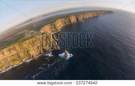 Beautiful Scenic Aerial Drone View Of Ireland Cliffs Of Moher In County Clare. Sunset Over The Cliff