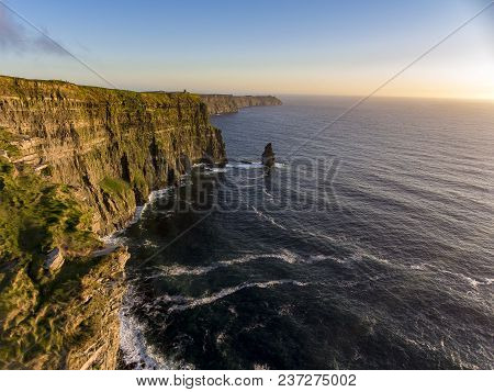 Beautiful Scenic Aerial Drone View Of Ireland Cliffs Of Moher In County Clare. Sunset Over The Cliff