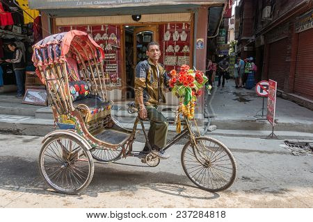 A Pedicab On Narrow Streets On March 25, 2018 In Kathmandu, Nepal.