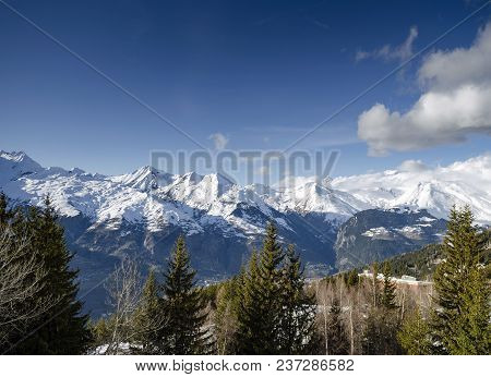 Sunny French Alps Landscape  And Snowy Mountain View In Les Arcs Ski Resort Near Bourg Saint Maurice