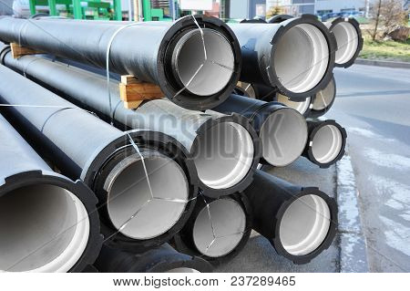 Ceramic Sewer Pipe Stacked On Construction Site