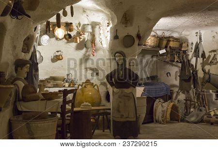 Matera, Italy - August 24 2017: Old Cavern House In Materia, Reconstruction Of How Families Lived In