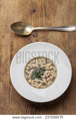 Bavarian Soup With A Spoon On Wood