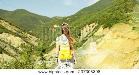 Young Traveler Woman Standing Among Hills And Enjoying The Freedom View In Albania