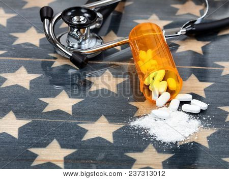 Close Up Front View Of Prescription Bottle With Generic Opioid Pain Killer Tablets. Rustic Usa Flag 
