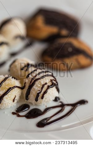Coconut Balls With Chocolate Sauce