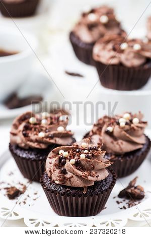 Chocolate Cupcakes Decorated Coffee Cheese Cream On A White Plate