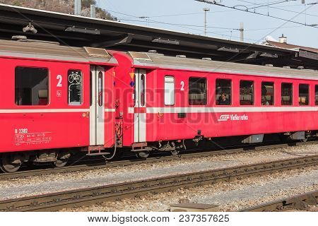 Landquart, Switzerland - 3 March, 2017: Railroad Cars Of A Train Of The Rhaetian Railway At A Platfo