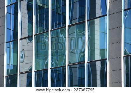Abstract Blue Reflections On Glass Windows Building