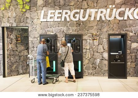 Reverse Vending Machine And Receive Money From Machinery At Supermarket