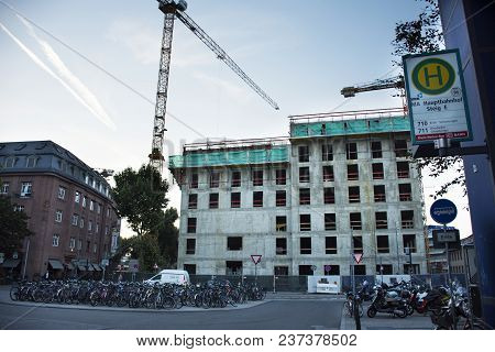 Construction Site With German People Stop Bicycle And Motorcycle At Parking Go To Train At Mannheim 