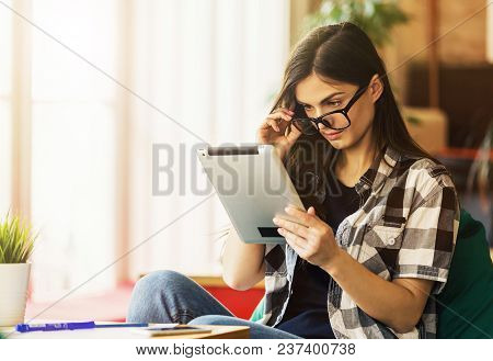 Beautiful Girl Enterpreneur Wears Eyeglasses And Stylish Shirt Work With Tablet Pc In Modern Office 