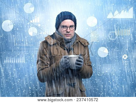 Young businessman shivering with graphs, reports and chart concept