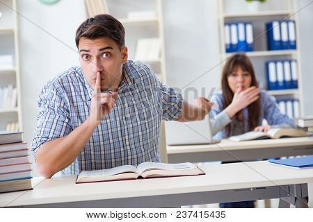 Students sitting and studying in classroom college