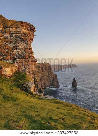 Beautiful Scenic Aerial Drone View Of Ireland Cliffs Of Moher In County Clare. Sunset Over The Cliff