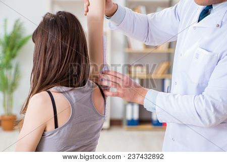 Doctor checking patients joint flexibility