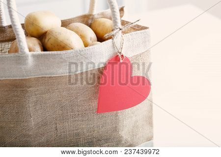 Potetoes In A Bag With A Heart Shaped Tag