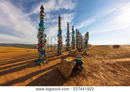 Shaman Poles Of Serge On Olkhon In The Sunset With Long Shadows