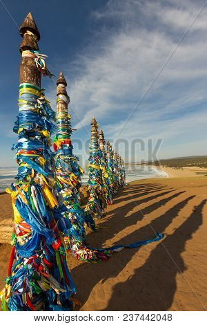 Shaman Poles Of Serge On Olkhon In The Sunset With Long Shadows