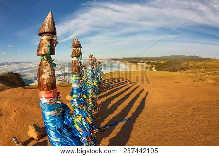 Shaman Poles Of Serge On Olkhon In The Sunset With Long Shadows