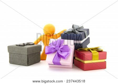 Orange Plasticine Character And Gift Boxes On White Background. Present Boxes. Holidays Concept.