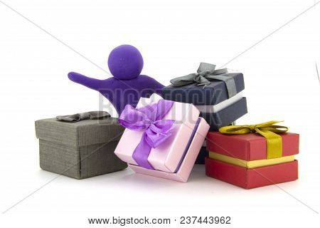 Purple Plasticine Character And Gift Boxes On White Background. Present Boxes. Holidays Concept.