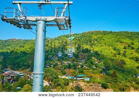 The Picturesque View On The Green Slope Of Kyaiktiyo Mount From The Cabine Of First Cable Car In Mya