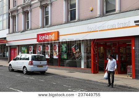 Barnsley, Uk - July 10, 2016: Man Exits Iceland Store In Barnsley, Uk. The Frozen Foods Company Icel