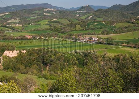 Panoramic View Of Rural Marche Landscape And Frontone Castle In The Background
