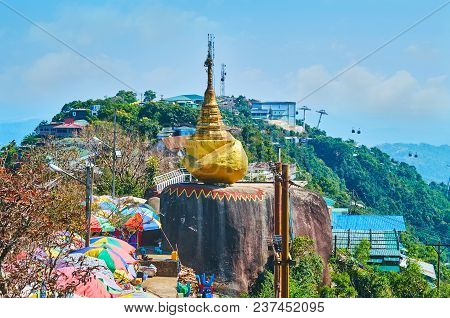 The Granite Rocks On The Slope Of Kyaiktiyo Mount Serve As The Buddhist Places Of Worship On The Way