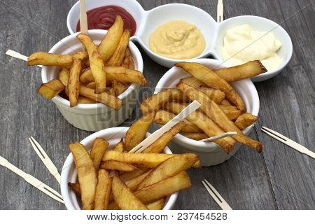 Tasty Food, Nutrition, Kitchen And Culinary Concept: Homemade Fries In Bowls For Snacks On Wooden Ba