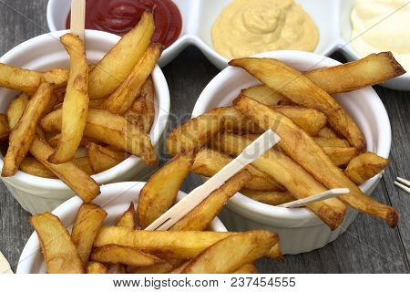 Tasty Food, Nutrition, Kitchen And Culinary Concept: Homemade Fries In Bowls For Snacks On Wooden Ba