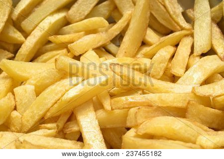 Tasty Food, Nutrition, Kitchen And Culinary Concept: Homemade French Fried Potatoes Background.