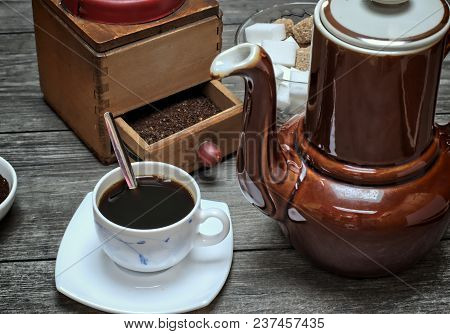 Drinks, Drinking, Energy And Caffeine Concept-old Kettle For Coffee, Coffee Cups And Grinder On A Wo