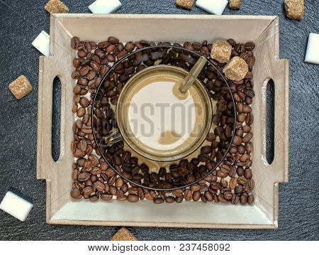 Cup Of Coffee With Milk,coffee Beans And Brown Sugar On Wooden Tray.