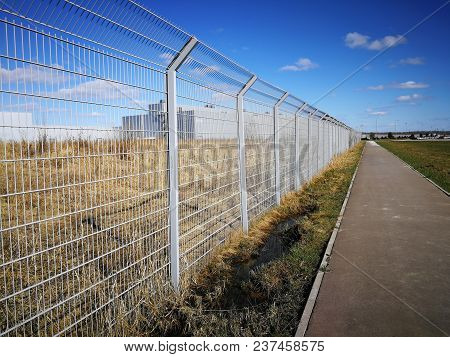 Steel Lattice Fence, Metal Wire Fence With Grass In The Background