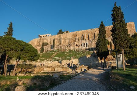 The Ruins Of Choragic Monument Of Thrasyllus And Theater Of Dionysus On The Southwest Slope Of The A