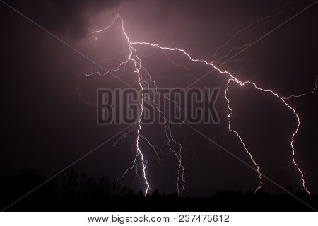 Lightning Strike At Night With Purple Haze
