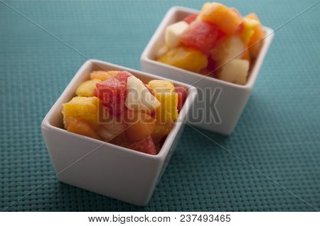 Fruit Salad Mix Of Melon, Banana, Watermelon, Orange And Pineapple In A Small Porcelain Bowl, Breakf