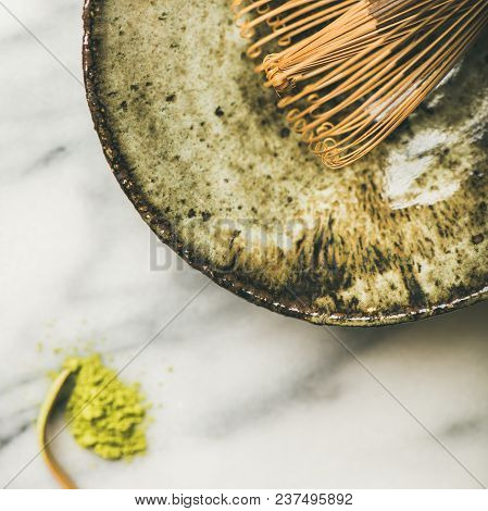 Flat-lay Of Japanese Tools For Brewing Matcha Tea. Matcha Powder In Tin Can, Chashaku Spoon, Chasen 