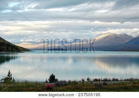 Last Rays Of The Sun On The Slopes On The Shores Of Lake Tekapo - South Island, New Zealand