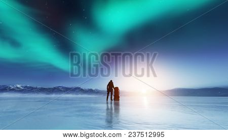 Adventurous man standing on a frozen lake with a backpack, looking at northern lights. Travel and adventure.