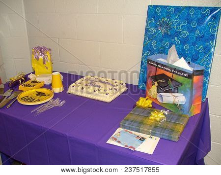 College Graduation Party Desert Table Setup With Cake, Paper Plates, Cups And Presents, Defiance Col