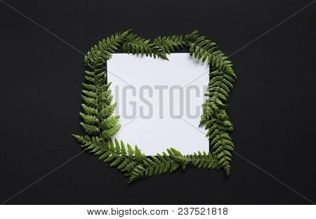 Artistic Mockup For Your Artwork With Beautiful Flowers And Leaves And Empty Card Shot From The Top.