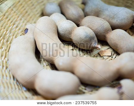Close Up Sweet Ripe Tamarind Pods In The Basket