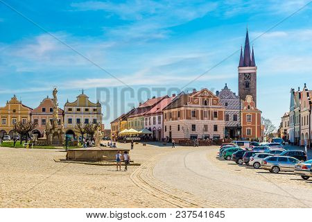 Telc, Czech Republic - April 18,2018 - View At The Painted Houses And Holy Ghost Church From Main Pl