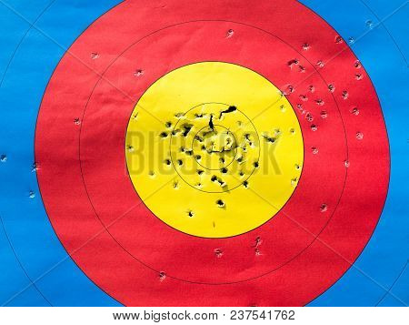 Close Up Front Of Archery Target With Many Arrow Holes